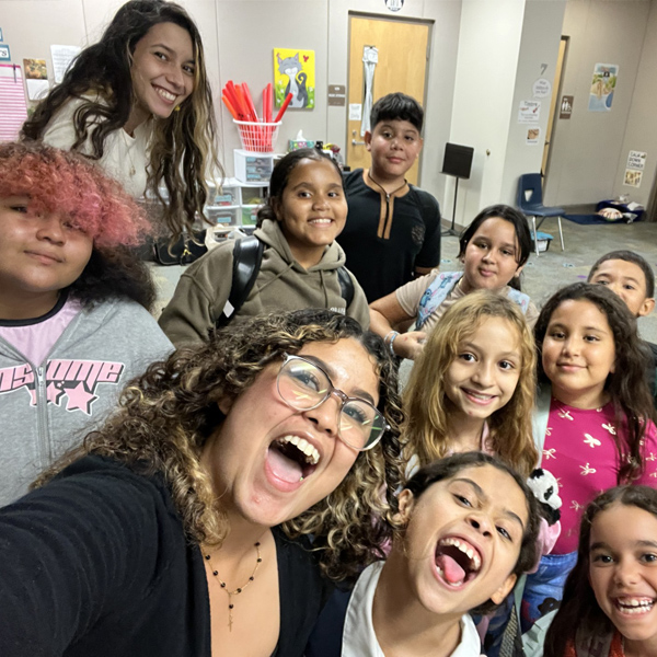 Happy students in musical classroom